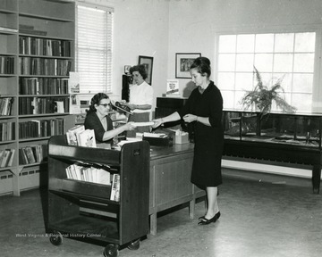 Interior of the Hardy County Public Library in Moorefield. This is one of six libraries in the United States to win the 1966 Book-of-the-Month Club Award. 'Bishoff's Studio and Camera Center, Moorefield, W. Va.'