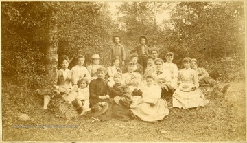 View of a group of women and children posed in a wooded area in Greenbrier County, W. Va.