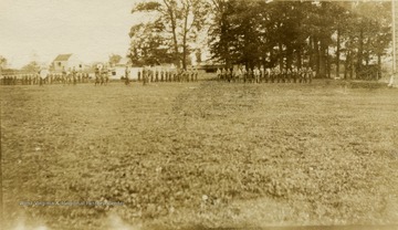 Scene of Military School students standing in formation for a ceremony.