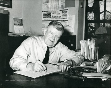 D. T. Moore at work in his office at the Greenbrier Military School.