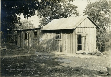 'Poultry house of Mr. J. R. Backer, Angerona. One hundred twenty-five fowls are housed in this house, 8'6" x 16'4" with shed 10' x 25'. Tin roof. Shed had three openings in the front 2'10" x 7'4".' From photo album labeled 'Stewart A. Cody, County Agent, Jackson County, 1912.'