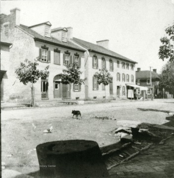 View of McMurran's Drug Store and Entler home 'later burned,' and Entler Hotel. The old house is on the present site of Jefferson Security Bank.