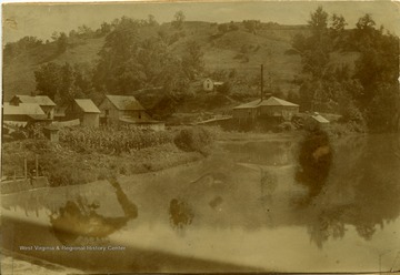 A view of the barely visible 'old dam, Arnold Livery, and Weston's first Electric Light Plant, J. S. Mitchell, Supt.'