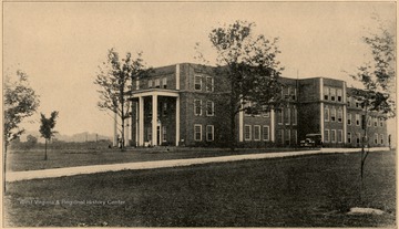 View of the State Hospital for Colored Insane. C.C. Barnett is the Superintendent in 1927. This intstitution is located at Lakin, Mason County, about nine miles up the Ohio River from Point Pleasant, and is reached by the Ohio River Division of the Baltimore and Ohio Railroad, or by bus or auto on State Route 62. Number of patients June 30, 1927 was 228.