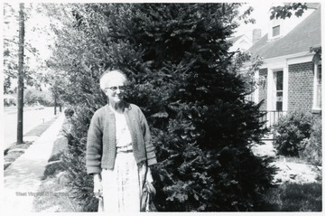 A photograph of Dr. Margaret B. Ballard standing outside in front of a tree.