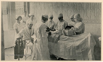Doctors and nurses operating on a patient in the Operating Room in Fairmont Hospital No. 3, in Fairmont, West Virginia.