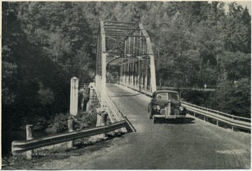View of car driving over W. Va. 39, Brock's Bridge over Gauley River.