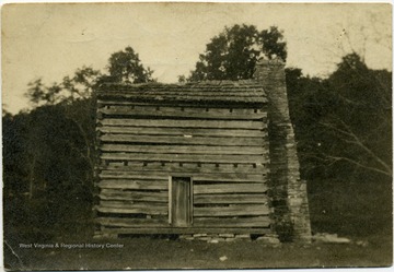 View of the early Ellison home, a split-log structure with a large flat rock chimney. John Zachariah Ellison was born there.