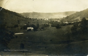 Post card photograph of the valley with John Zachariah Ellison's house is seen in the foreground.