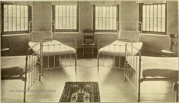 An interior view of beds in the dormitory at the Second Hospital for the Insane.