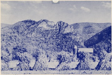 'A typical West Virginia farm scene with majestic Seneca Rocks in the background. Located on U.S. Route No. 33 in Pendleton County.'