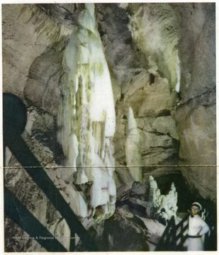 A man stands and looks at rock formations in Seneca Caverns in Pendleton County.