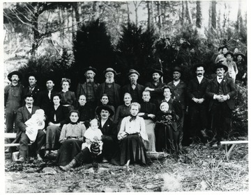 'Probably parents visiting Propst School on the last day of the term. Front Row Left to Right:  Lutheria Propst, Erma Snyder, Harry Pleasant Snyder, Cora M. Snyder; Second Row Left to Right:  John Dahmer, Ella Vaden Dahmer, Estella Dahmer, Mary Propst, Henrietta Propst, Mulvina Propst, Sarah J. Propst, Elsie M. Blizzard, Sarah J. Blizzard; Third Row Left to Right:  Willian E. Propst, Hendren Propst, Walter P. Propst, Hetty V. Propst, Benjamin Propst, Lewis Propst, David Propst, Philip E. Rader, Jacob Mitchell, Granville H. Blizzard, Jacob A. Propst