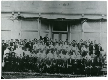 Teacher's Institute.  Taken in front of Ken Bogg's store in Franklin, W. Va. Front Row: 3rd from left; Ashby Bowders, 5th from left; John Dahmer, 11th from left; Flick Warner, far right; Walter Headrick; Second Row: 2nd from right; John Ritchie; Third Row: 3rd from right; Curt Hammer; Fourth Row: 2nd from left; Clay Ruddle, 3rd from left; Elmer Propst, 10th from left; Jessie Hammer, 15th from left; Nora Dyer, 18th fom left; Winton Judy, 3rd from right; Arlie Simmons; Back Row: 10th from right; Newton Ruddle