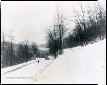 Entrance Gate to the Monongahela National Forest in winter, located 5 miles east of Elkins, W. Va. on U. S. No. 33.  (The gateway was constructed of stone taken from the chimneys of the Ezekial Harper Homestead on Clover Run in Tucker County.) O. Homer Floyd Fansler, Hendricks, W. Va.