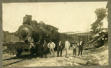 Old 299 Passenger Train, 1907.  Z.W. Lafon was the Engineer.  Pictured:  M.H. Bill Sneads (father of Earl Sneads et. al.), Casey Dillon (fireman), Mars (conductor), Bill Matson (baggage master), Bill 'Black Bill' Millioms (breakman), Roger Keyser, boy and last man are 'stand-ins.'