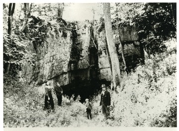 George W. Hammer and Isaac Hammer at the cave in Harmon Hills, where their grandfather Jacob Harper was born in 1744, and where their sons mined salt peter which they sold at 50 cents per pound.