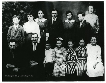 Pictured in the front row, left to right; Preston Dickenson, John Dahmer, William Cecil Propst, Nellie Propst, Lucy Verona, Ella Varden Dahmer and Beula Evick.  Pictured in the back row, left to right: Wm. Lester Waggy, Ida Viola Eye, Elsie Evick, Raymond Guy Dickenson, Etta Margaret Evick, Ivan Hoe and Mary Hazel Dickenson.
