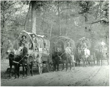 Freight was hauled over mountains by horses and wagon trains due to bad roads.  Photo was taken in Briery Branch, Va.  People and wagons from Pendleton County, W. Va.