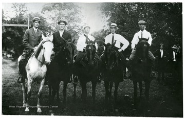 Taken in long field on S. M. Conrad farm at Ruddle.  From left to right- Sam Harper, Foster Hendrick, Jud Ruddle, John Preston Ruddle, Baxton Harper, Leon Wimer.  In the main tournament, Foster Hendrick placed first, Preston Ruddle second, and Jud Ruddle third.  For graceful riding Baxton Harper got first badge, Preston Ruddle second, Sam Harper third, and Jud Ruddle fourth.  Foster Hendrick crowned Miss Fannie Dahmer queen of love and beauty.  Preston Ruddle crowned Miss Clara Ruddle first maid.  Jud Ruddle crowned Miss Jessie Painter second maid.  Baxton Harper crowned Miss Virgil Judy third maid.  Sam Harper crowned Miss Estella Evick fourth maid.  The day ended with a dinner given by S. M. Conrad.