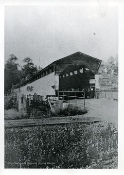 'Patron D. Mark Gaston, of Harrisville, identified this photo as the covered bridge outside Cairo, West Virginia, which spans the North Fork at the Hughes River. C and K Railroad tracks are in the foreground.'