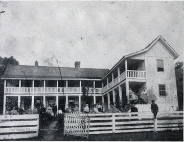 Front view of John Coiner house with people standing in front. House is located near Pence Springs, W. Va.