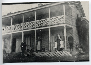Home of Thomas Marvin Deeds, standing far right. Built by Joseph Deeds around 1820, this was the first brick house built in Summers County. The bricks used in its construction were made on the property.The people in the photo, from left to right:Clarence DeedsNancy Milburn Hinton DeedsTilda ParkerLina Deeds ParkerOna ParkerThomas Marvin Deeds