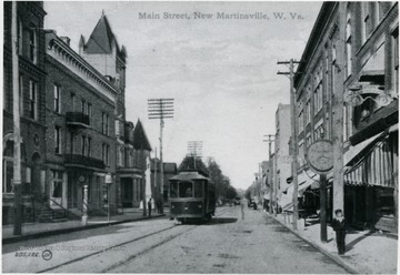 View of a trolley and businesses on Main Street in New Martinsville.