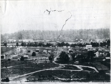 'Picture was taken from the grade school hill. K of P Building No. 1.  Advocate Building No. 2.  O. Homer Floyd Fansler, Hendricks, W. Va.' is written on the back of the photo.
