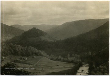 'A recreation reserve around Point Mountain would comprise inspirational scenery, the attractiveness of which is due largely to the sheltering mantle of green timber. Elk River Valley several miles about Webster Springs. Bureau of Agricultural Economics Photographs Division'