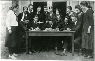 Photograph of the Mountaineer Editorial Staff working.