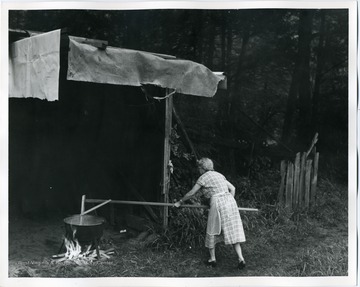 A woman is stirring applebutter in Webster County, West Virginia.