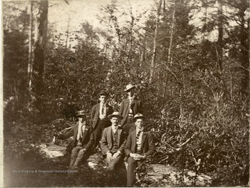 Back row- Bill Dumire, Joseph Summers.  Front row- Charley Poling of William, W. Va. (in middle).