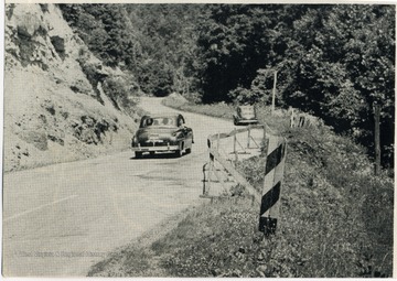A car drives down the road on W. Va. Number 20.