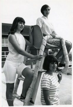 'From left to right:  Nelda Gilmore, Maid of Honor from Terra Alta, Roseann Carrico of Kingwood, seated, and Lynne Taylor.'