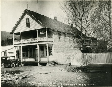 View of the building with the general store, post office, and N. E. Walton residence.