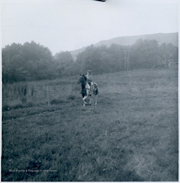 Miss Laura Lee McCoy warming up her Arabian mare for the fourth annual Albright Horse Show, August 12, 1962. This will be a 23 class event.