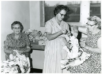 Pictured left to right; Mrs. Paul Frankhauser, Mrs. Ronald Parsons and Mrs. Donald Watring in a sewing circle.