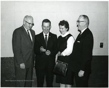Pictured left to right; A.J. Anderson (Preston County Coop. ext. agent), Mr. and Mrs. David Stemple and Aurora L. Bush Swisher (FBI project director).