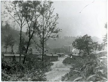A coal camp is nestled in a valley near the tipple of the mine.