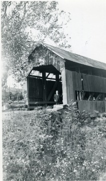 View of man standing at south end of the Sardis covered bridge.