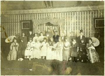 'Beckley-Hinton elite splurging in costume party.  Group portrait of guests in full costume.'