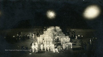 Members of the First Aid group are lined up with their hard hat lights shining at midnight on August 24, 1934.