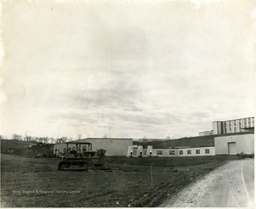 'Foreground, Agricultural Engineering Building; background right, Agricultural Sciences Building; background middle, greenhouses.'