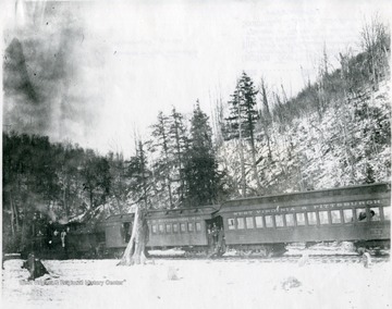 'Passenger train on the W. Va. and Pittsburgh Railroad on the grade between Hendricks and Thomas in Tucker County.  This became a B. &amp; O. branch. O. Homer Floyd Fansler.'