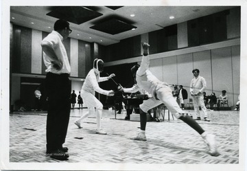 Two fencers are participating in a competition.