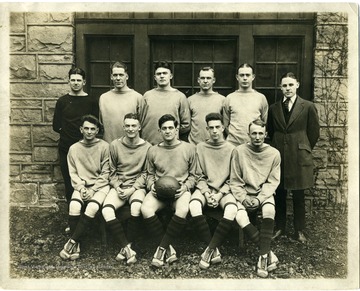 Group portrait of the West Virginia University Basketball Team, 1921: 'Standing: Coach Stadsvold, Russell Meredith, Clem Kiger, Robert Hawkins, Douglas Bowers, Manager Harry Watkins. Seated: David Graham, George Hill, Captain Homer Martin, Pierre Hill, Fred White.'