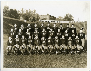 'The 1934 West Virginia University Football Squad. Bottom row: (left to right)Scott 12; Onder 28; Thomas 25; Poilek 24; Swisher 19; Allen 20; Slate 22; Stewart 15; Heath 11; Vargo 26; Goodwin 14. Middle row: Hester 33; Cropp 27; Johnston 23; Fidler 15; MaWhinney 30; Stydahar 35; Schimmel 34; Kyle 16; Mayes 32; Hall 13. Top row: Phares 10; Forte 17; Gibson 18; Zaleski 48; Huyett (no number); Barna 29; Gooke 21; Frantz 32; Wilson 18; Kell (no number).'
