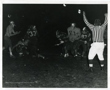 Referee signals during a West Virginia University Football Game.