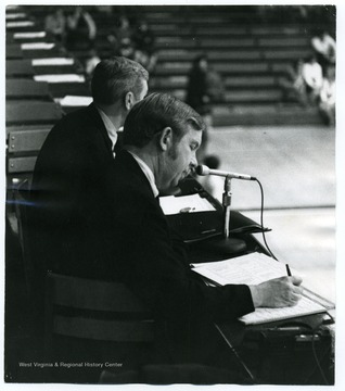 Radio Announcers Jack Tennant and Jack Fleming call a game for the Mountaineers.